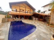 Casa com 7 dormitórios, sendo 6 suítes, com 4 vagas de...