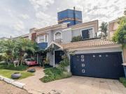 CASA DE 4 DORMITÓRIOS EM CONDOMÍNIO 320 m² 4 VAGAS DE...