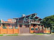 CASA DE ESQUINA COM 3 DORMITÓRIOS, 2 SUÍTES NO BAIRRO...