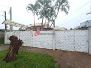 Casa tÃrrea com anexo nos fundos e sala comercial