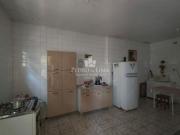 Casa terrea na frente e um sobrado nos fundos na região...