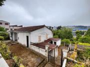 CASITA CON TERRENO Y BUS URBANO