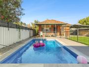 Central Red Brick with Pool & Outdoor Appeal