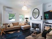 CHARMING LOWER DUPLEX STEPS TO THE BEACH!