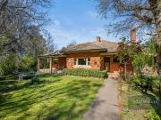 CHARMING RED BRICK IN A SOUGHT AFTER SETTING