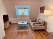 Charming two storey apartment with workspace in a green... Charming two storey apartment with workspace in a green...