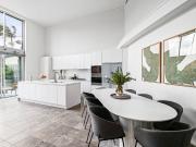 Coastal Elegance with Soaring Ceilings and Sunlit Spaces
