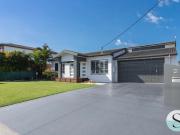 Coastal One Level Entertainer One Home From the Sand...