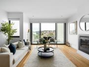 Contemporary Coastal Elegance with Bay Glimpses