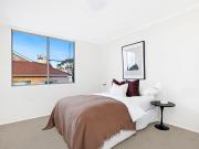 Convenient top floor living with city skyline views