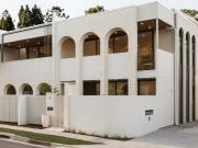 Corner Position with Arched Windows and Elevated Living