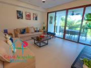 Depa de playa con terraza y vista a los jardines y...
