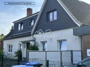 DHH mit Gewerbeeinheit und Einliegerwohnung in Travemünde