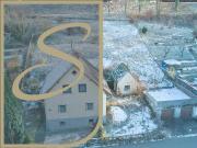 Einfamilienhaus mit begonnenem Ausbau und zwei Garagen!