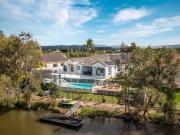 Elegant Waterfront Family Living with Resort Style Pool