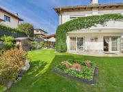 Elegantes Doppelhaus mit wunderschönem Garten in Bedano