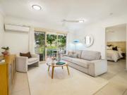 Elevated Ground Floor Apartment Footsteps from the Sand...