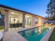 Elevated Sanctuary with Sun Kissed Pool and Skyline Views!