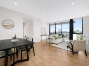 Elevated Urban Retreat with Dual Balconies & Designer...