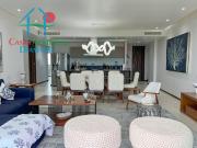 En condominio de playa con terraza y vista a las albercas