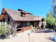 En venta parcela con hermosa casa de maderas nativas, en...