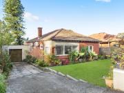 Charming Double Brick home offers an abundance of potential