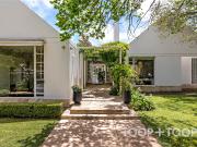 EXPANSIVE ARCHITECTURAL ENTERTAINER SITUATED ON SWEEPING...