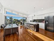 Expansive contemporary, paces from surf and sand