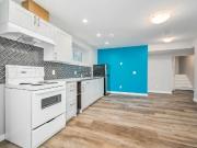 Exquisite 1 Bed + Den Basement Suite