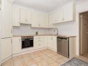 Family‑friendly freestanding home with a private outdoor...