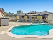 Family Living with Pool and Parking Galore Ideal...