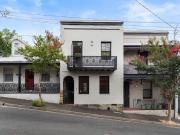 Family sized terrace on a street to street block in a...