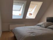 Feel at home in this modern rooftop apartment with roof...