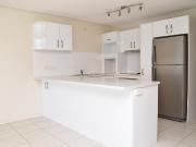 Footsteps to surf and sand