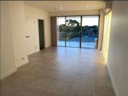 FULL TILED LIVING AND DINING AREA FACING THE BACK OF THE...