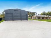 Fully Renovated Oasis on Spacious Acreage