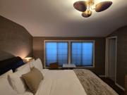 Furnished king sized bedroom with private bath