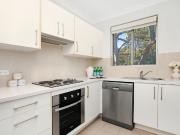 Generous functional top floor living in leafy setting