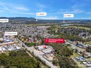 High profile industrial site with development upside