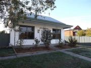 IDEALLY SITUATED AND UPDATED THREE BEDROOM HOME