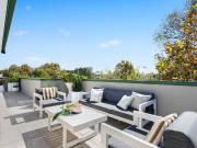 Immaculate top floor home with entertainer's terrace...