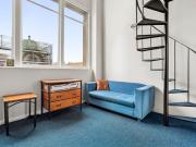 INVEST OR OCCUPY THIS LARGE SUNNY LOFT STYLE APARTMENT