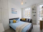 Large Studio with Large Windows and Full Kitchen