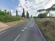 LAURENTINA BILOCALE CON GIARDINO E POSTO AUTO