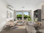 Light filled apartment with pool and parking