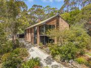 Light filled living surrounded by nature