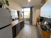 Light filled living with sea views