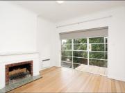 Light filled top floor apartment in small Art Deco building