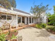 Light filled weatherboard home with studio and...