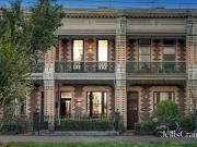 Located in the Village between the City and the Sea